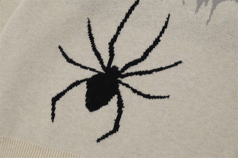 Men's sweater designed with a spider appliqué and a ripped fabric style