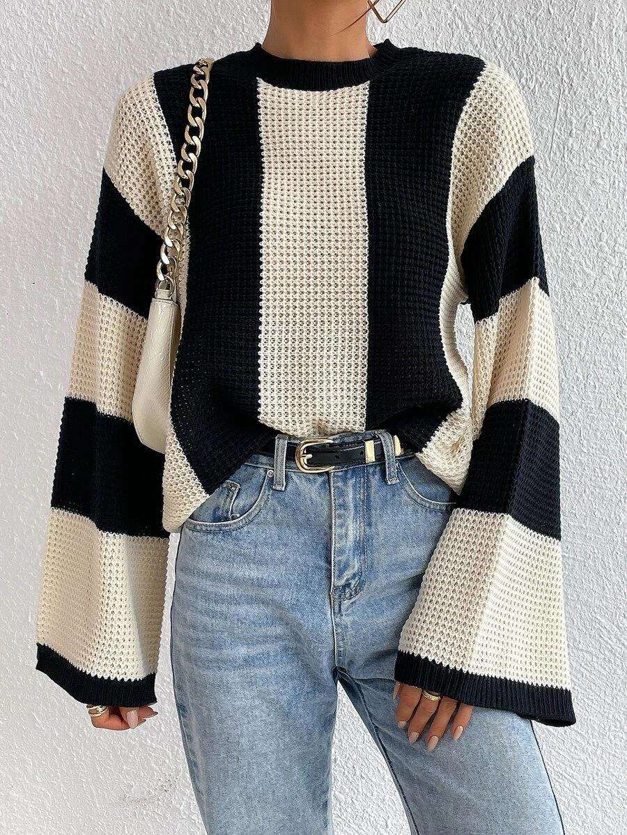 Striped knitted sweater with a round neckline for women