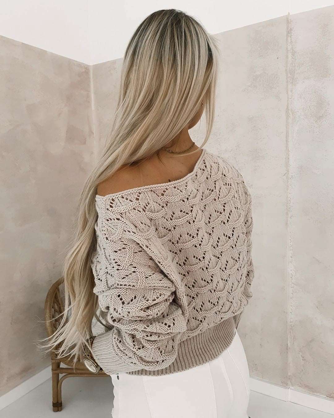 "Women's off-shoulder hollowed leisure long sleeve pullover sweater."