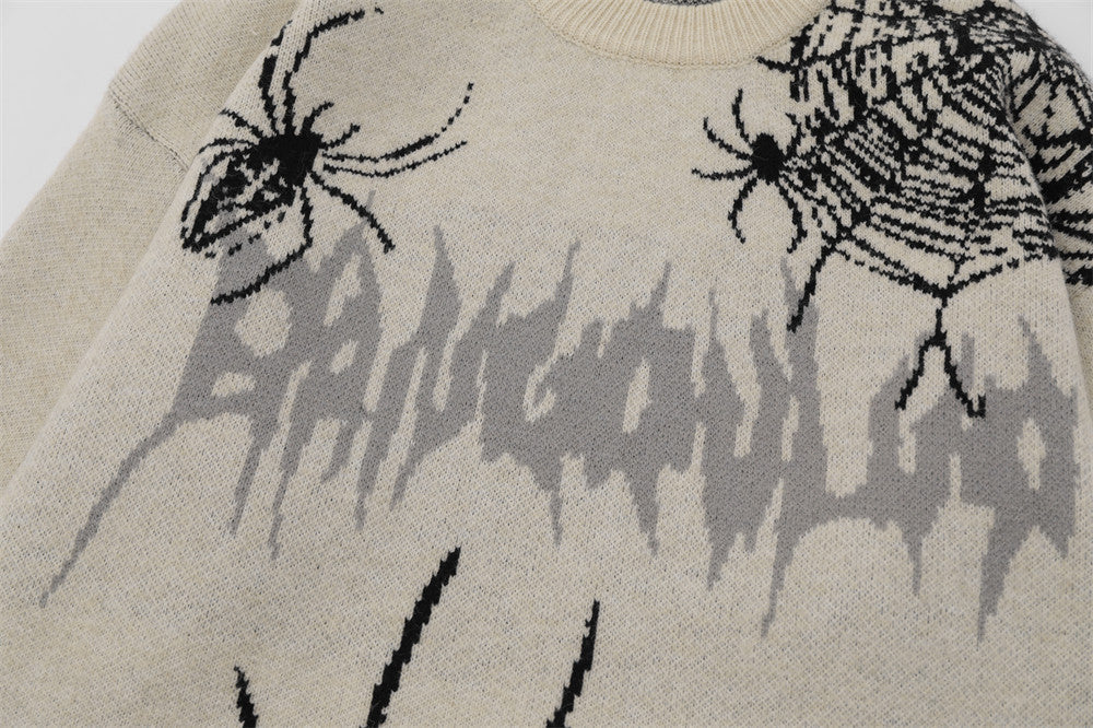 Men's sweater designed with a spider appliqué and a ripped fabric style