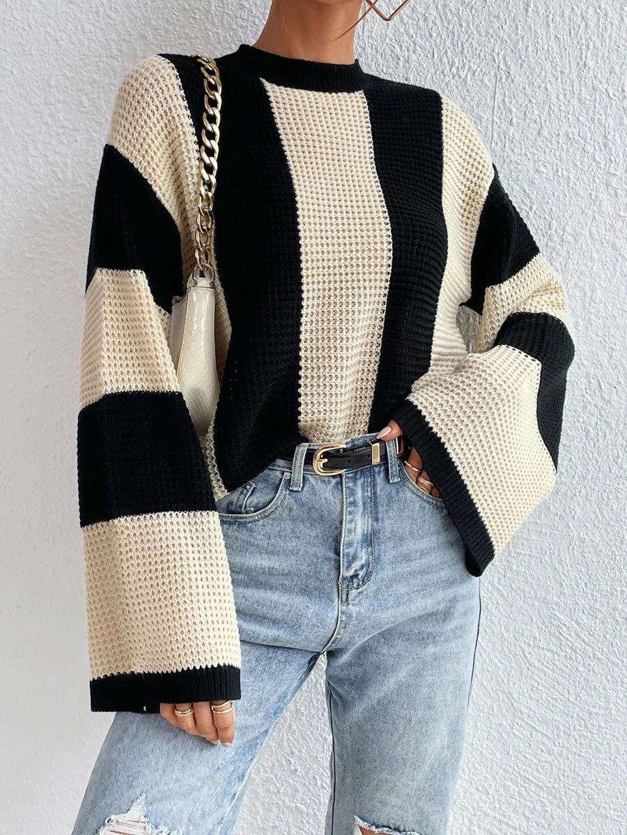 Striped knitted sweater with a round neckline for women