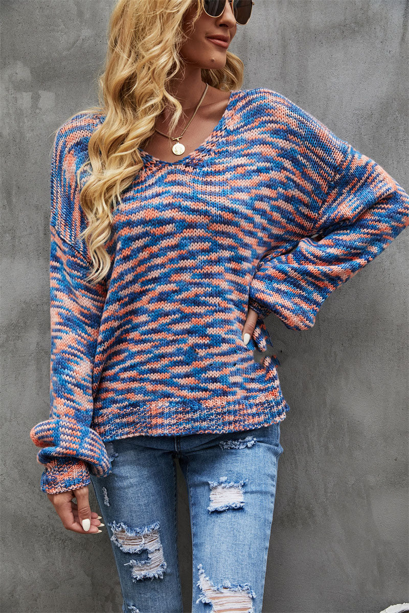 Stylish women's wide V-neck sweater with a beautiful pockmarked texture